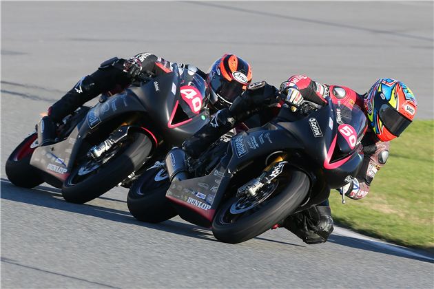 Latus Motors Racing/Castrol Triumph's Bobby Fong (50) leads Jason DiSalvo (40) into a corner at Daytona.